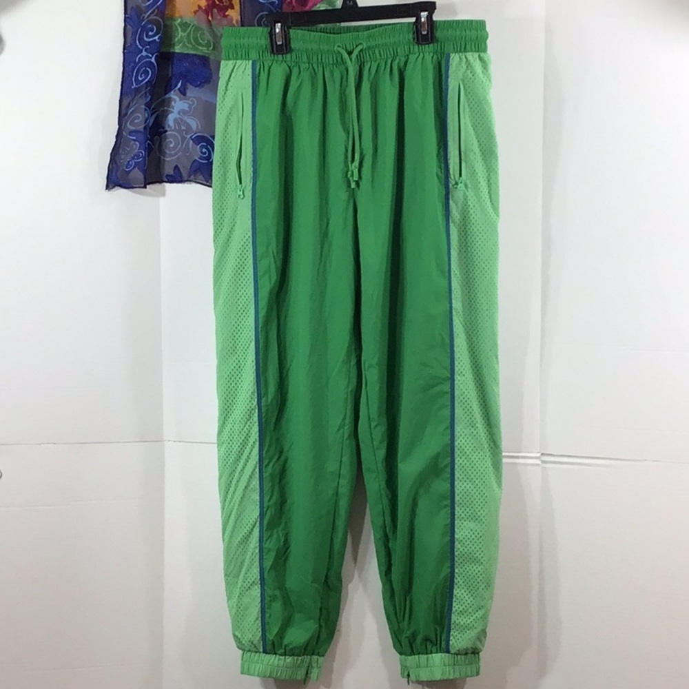Lacoste women’s green perforated effect track pants